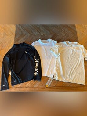 Hurley Black Long Sleeve Rash Guard, White Cat & Jack Long Sleeve Rash Gard, and
